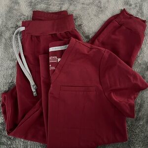 Fabletics Burgundy Scrub Ensemble XS Jogger Style pants have 4 pockets total